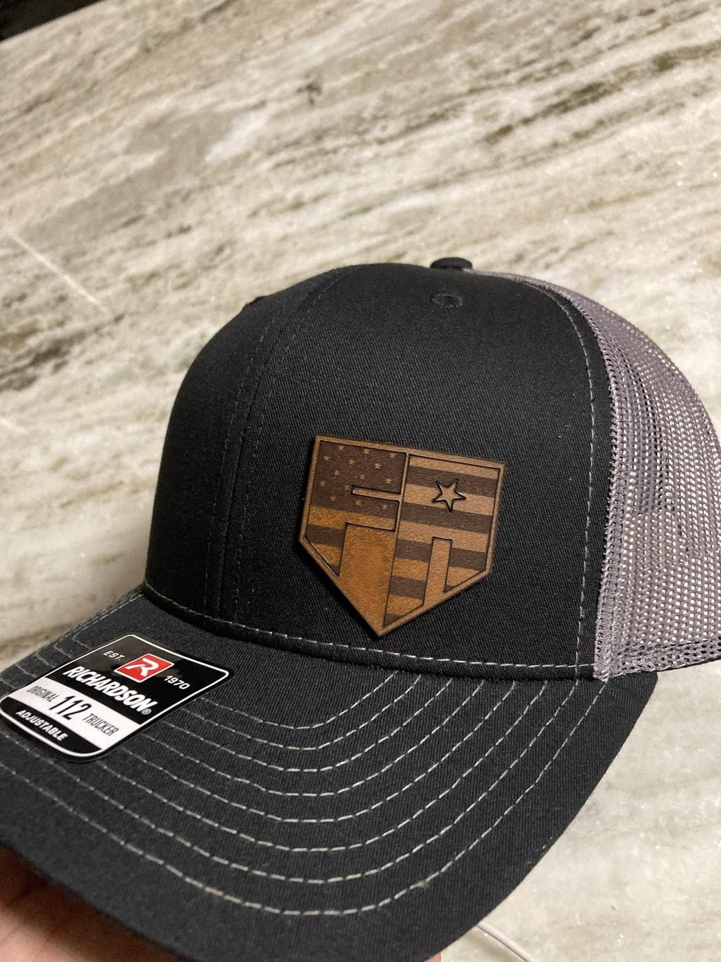 American flag shield leather patch trucker hat